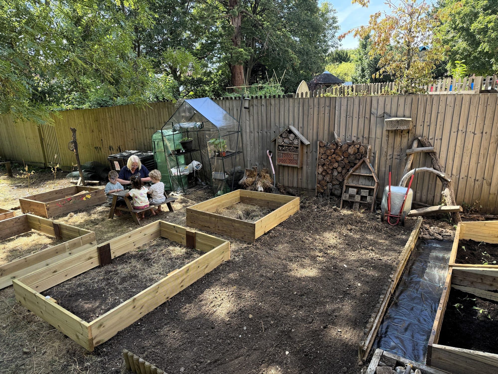 Raised vegetable beds in the garden at The Manor House Nursery, Westbury on Trym
